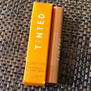 Huestick Tinted live eye cheek lip stick in color “origin” red